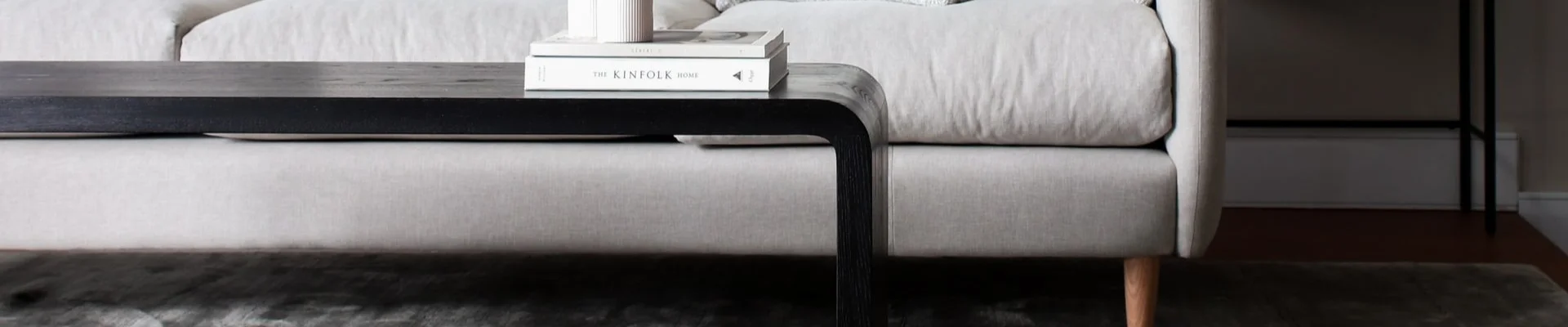 grey sofa besides a modern coffee table