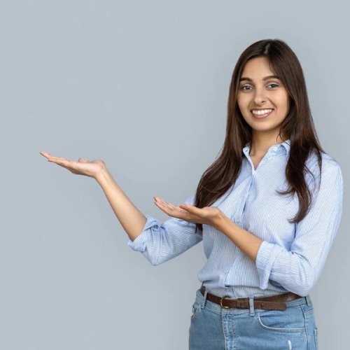 woman smiling wearing jeans and a blue shirt