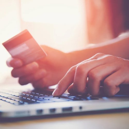 woman making a payment with her credit card